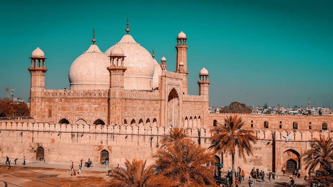 Photo by abdullah shehroz a large building with two towers and a dome