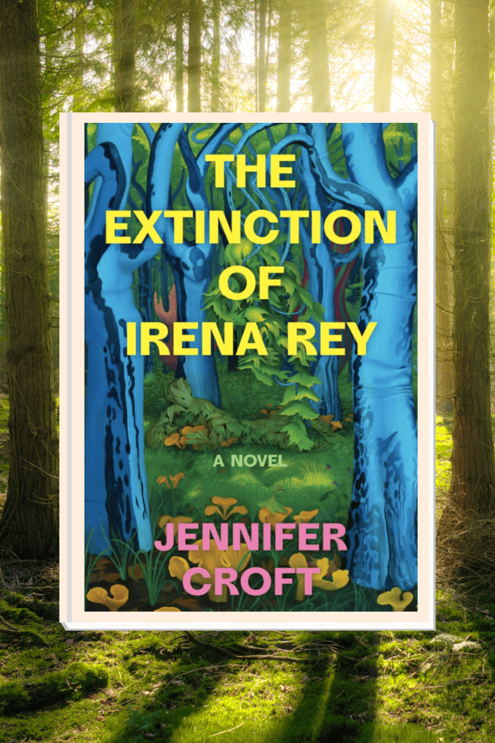 The Extinction of Irena Rey book cover in front of a background of a forest.